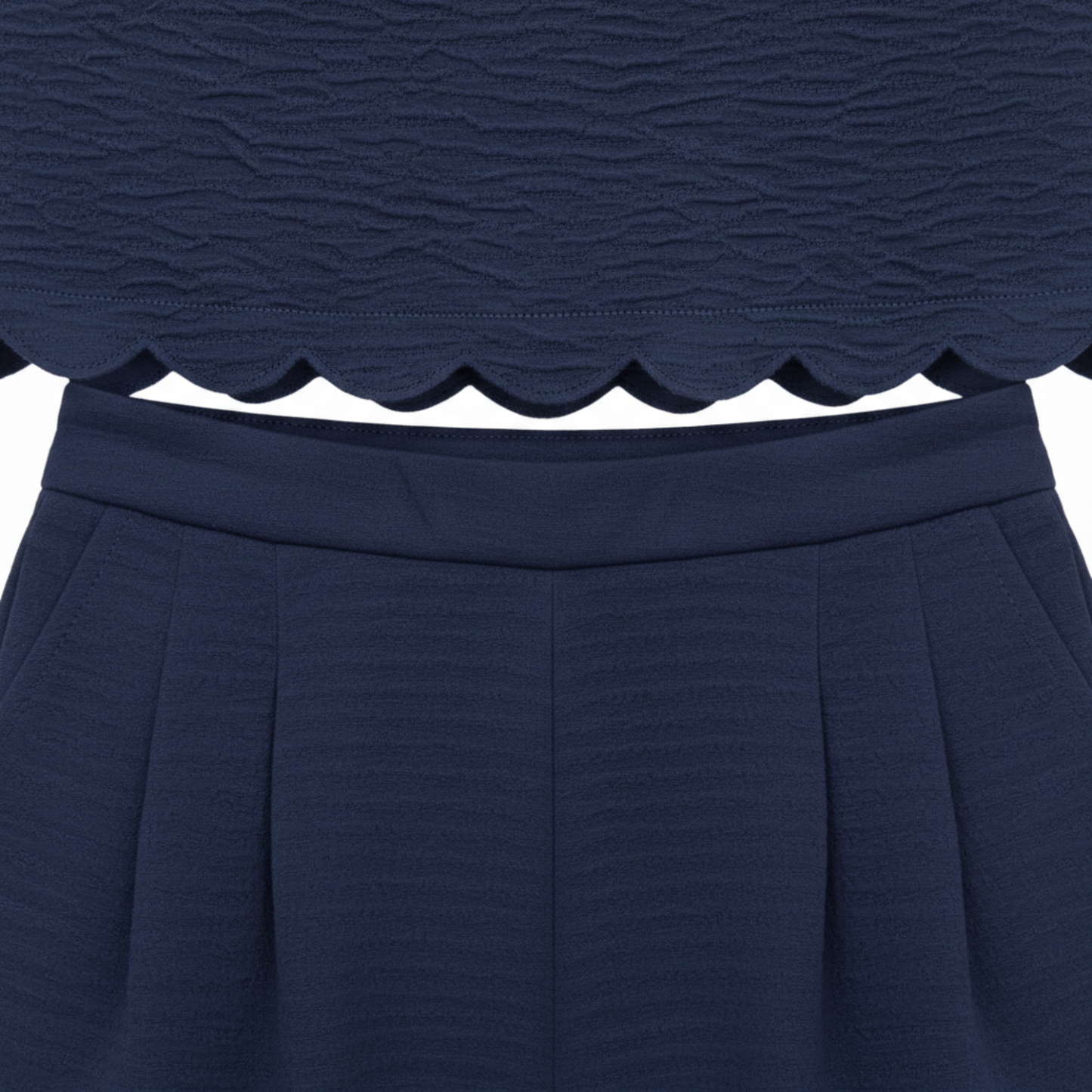 Two-piece women's set: sleeveless top with scalloped edge and wide ankle-length pants