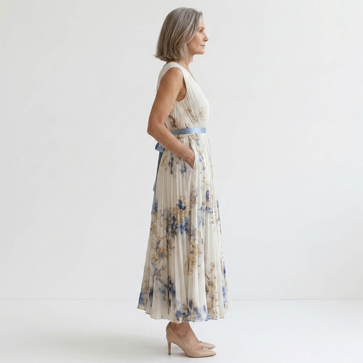 Mid-length floral dress — V-neck and pleated skirt with pockets — vacation